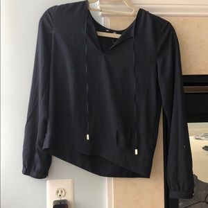 Navy blouse with gold detailing.